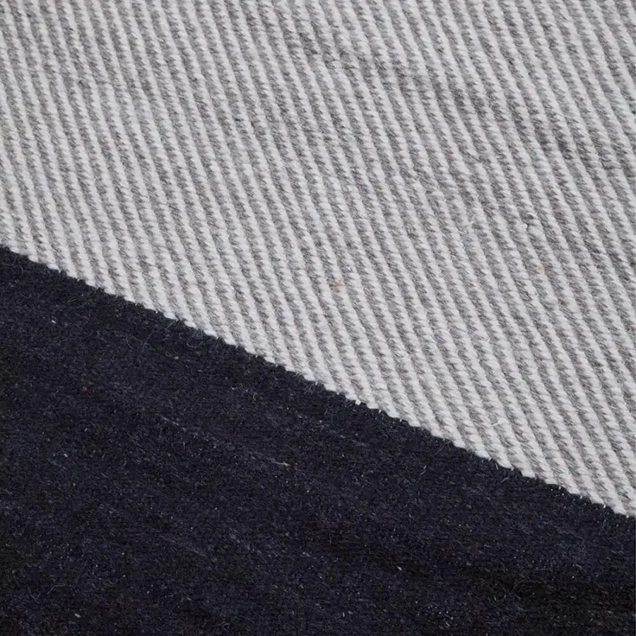 Superior Amini Khilim rug hand-woven in India from pure wool with a dramatic diagonal color block and carved finish