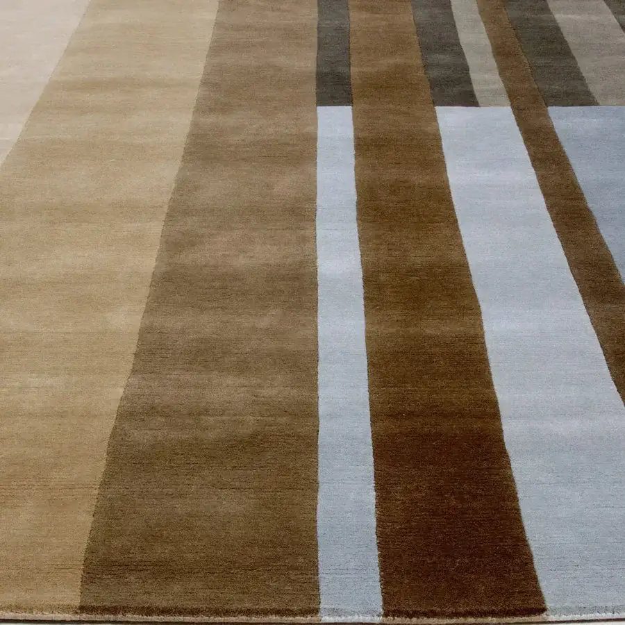 Distinguished Amini RD Braque rug hand-knotted in New Zealand wool with striped brown, beige, gray and muted blue hues and carved finish