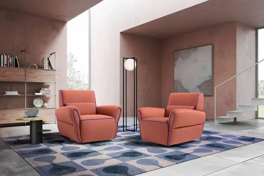 Distinguished Egoitaliano Mariù lounge chair built with textured terracotta fabric, royal blue trim and a wood frame combined with biodegradable particles