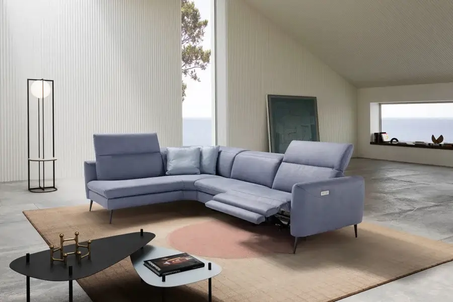 Elegant Egoitaliano Dusk sectional upholstered in soft dusty blue-grey textile with visible stitching and painted metal feet