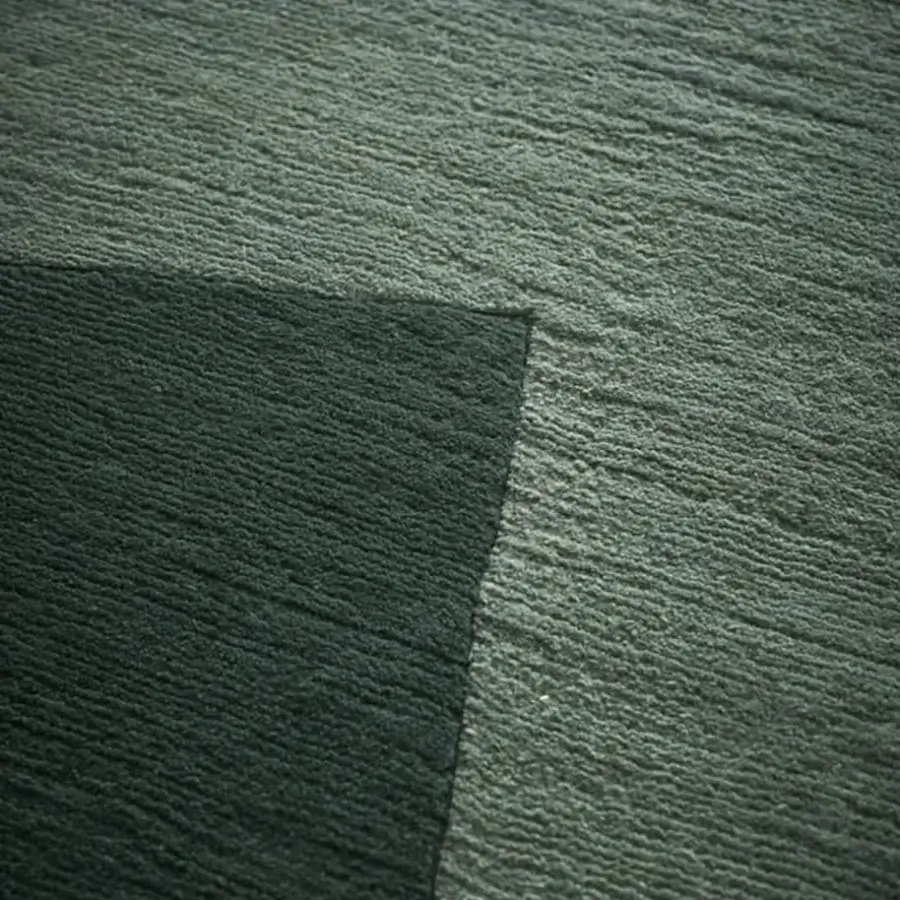 Distinguished Amini RD Shade rug hand-knotted in India with a blend of wool and silk exhibiting shifting shades of green and a carved finish