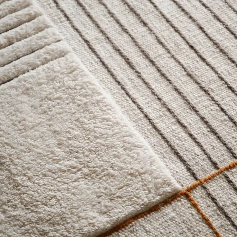Distinguished Amini RD Halong rug crafted in India with off-white wool and muted orange linear elements, hand-washed finish