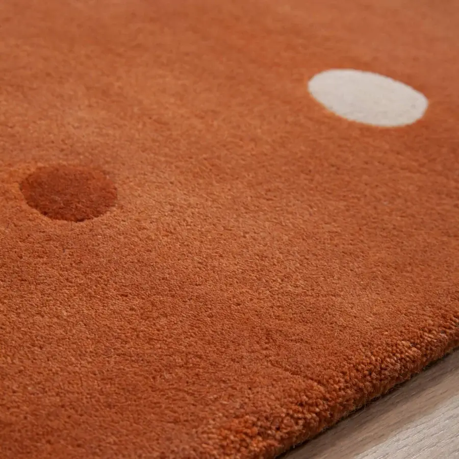Distinguished Amini JC-1 Bubbles rug with dynamic circular motifs hand-tufted in warm rust and cream New Zealand wool with a finished pile
