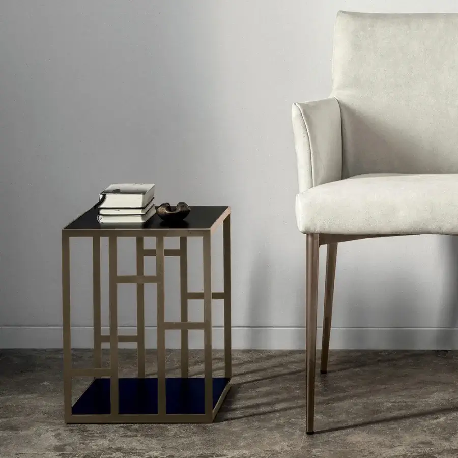 Distinctive Bontempi Manhattan side table with geometric design and glossy dark blue tabletop in muted gold-tone metal