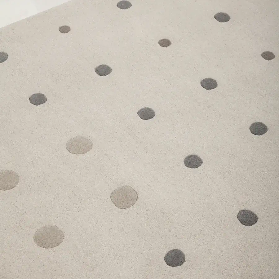 Exceptional Amini JC-1 Bubbles rug with circular motifs in rust and cream hand-tufted New Zealand wool with a beautifully finished wool cut pile
