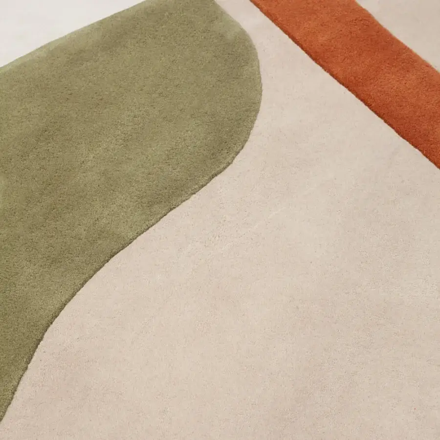 Sophisticated Amini JC-7 Isola rug with organic form in terracotta orange, olive green, and New Zealand wool with a matte finish