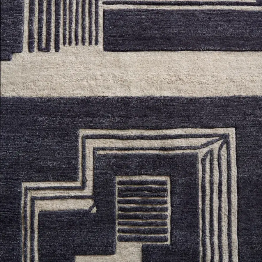 Exceptional Amini Maze rug with black and ivory geometric patterns hand-knotted in Tibetan wool with a clipped and carved finish