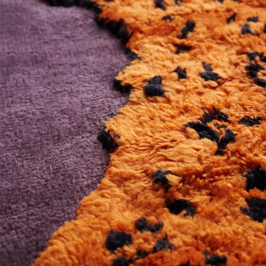 Innovative Amini Tapipardo rug hand-knotted in pure wool with a lavender base and vibrant orange carved pile finish