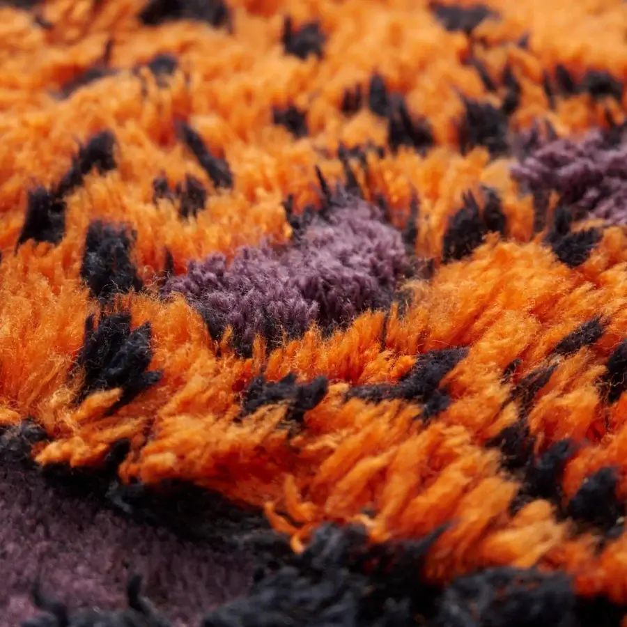Distinguished Amini Tapipardo rug hand-knotted in pure wool with saturated orange and black blocks against a purple-gray base and carved pile finish