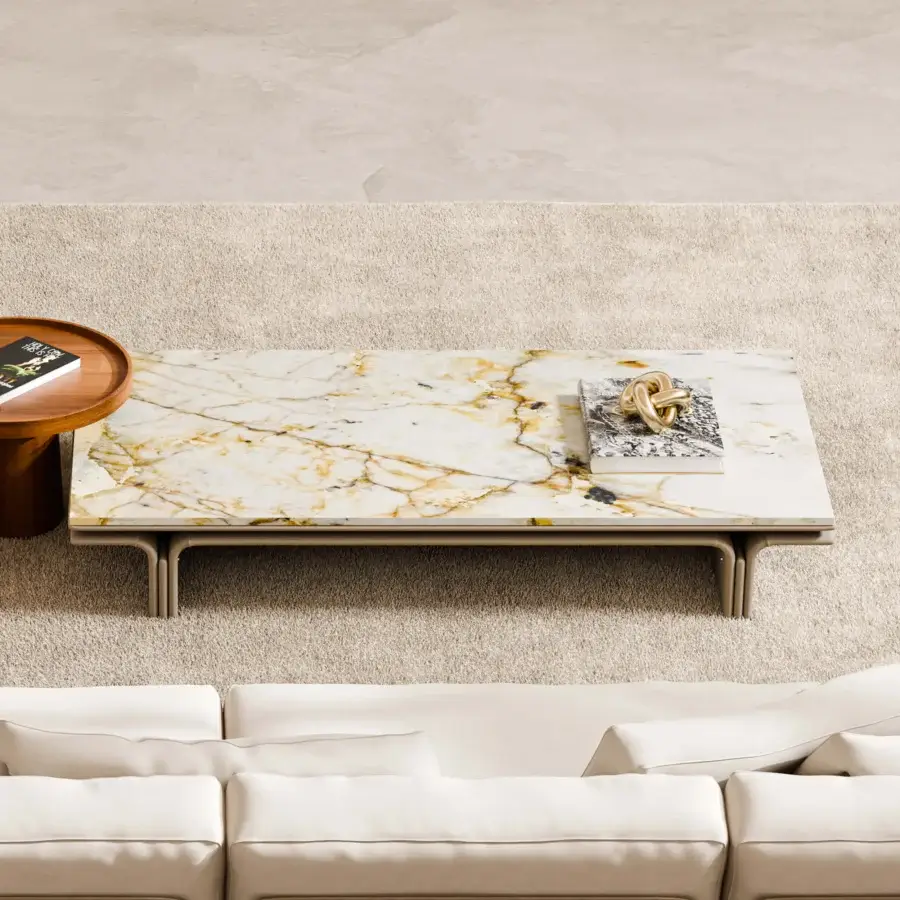 Lavish Mascheroni Jazz John coffee table with a cream and gold Patagonia marble tabletop and handmade leather base