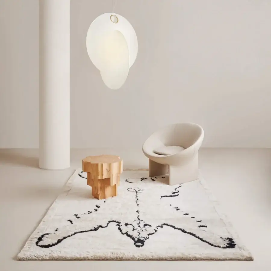 Lavish Amini Tapiorso rug hand-knotted in India with ivory wool displaying a black abstract design and clipped pile