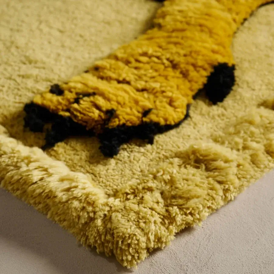 Distinguished Amini Tapileo rug hand-knotted in Italy with a playful giraffe design and plush pure wool construction