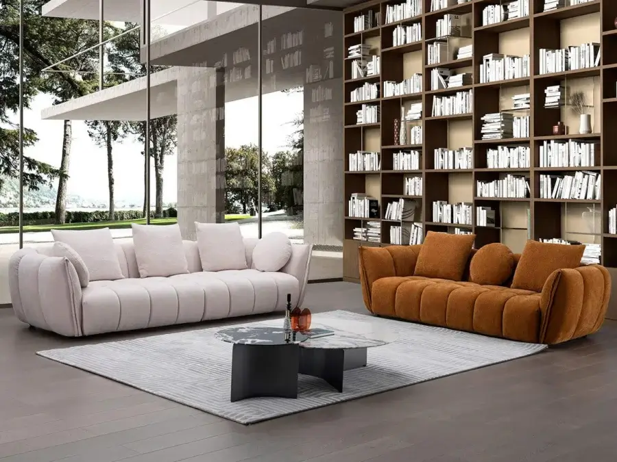 Captivating Egoitaliano Eros sofa with blush textile upholstery, curved form and wood frame built with biodegradable particles
