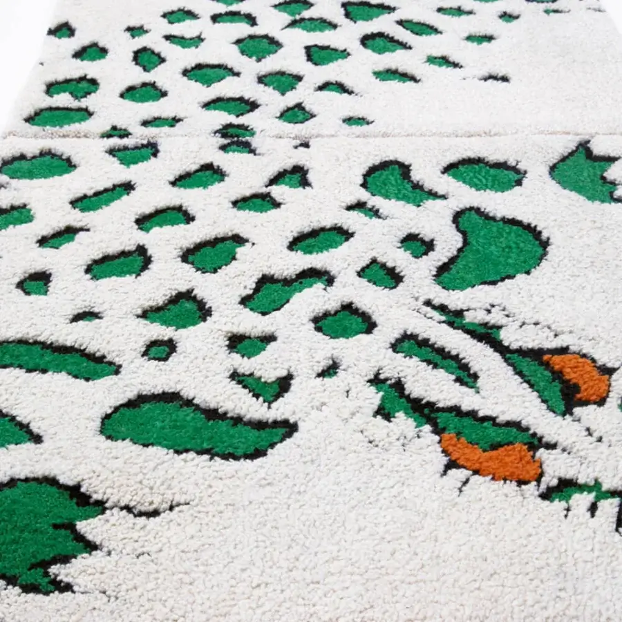 Distinguished Amini Tapidrago rug hand-knotted in pure wool with a striking green and off-white geometric dragon design and hand-washed finish