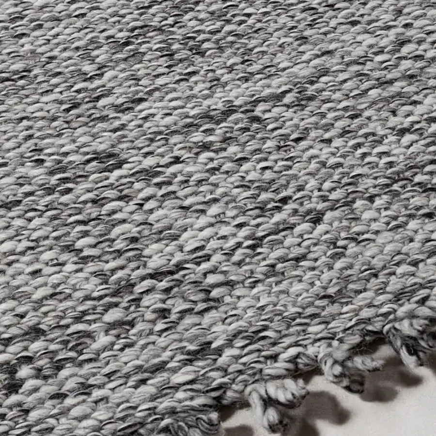 Lavish Amini Jackie rug hand-woven in India with cream and black wool exhibiting delicate fringed edges