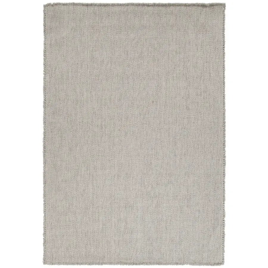 Meticulous Amini Jackie rug hand-woven in India from cream wool exhibiting a subtly mottled surface with finished fringes