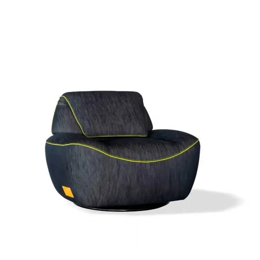 Distinguished Egoitaliano Smirk lounge chair with enveloping form upholstered in textured dark wash blue textile and yellow stitching with a black painted steel base