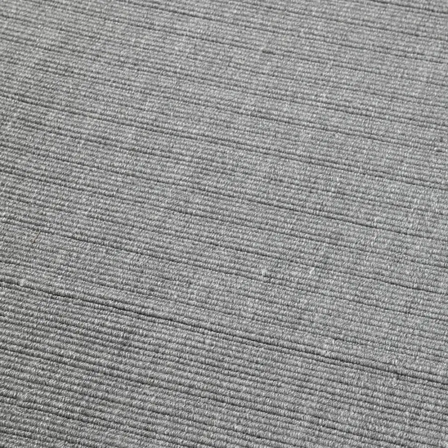 Elegant Amini Pierre rug hand-woven in India from recycled PET with heathered gray tone and hand-clipped finish