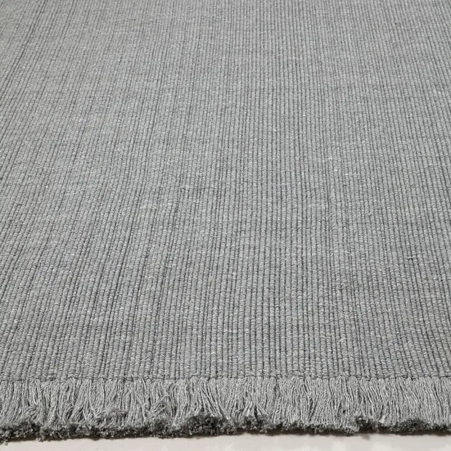 Exceptional Amini Pierre rug hand-woven in India from recycled PET with raw fringed edges and tonal variations