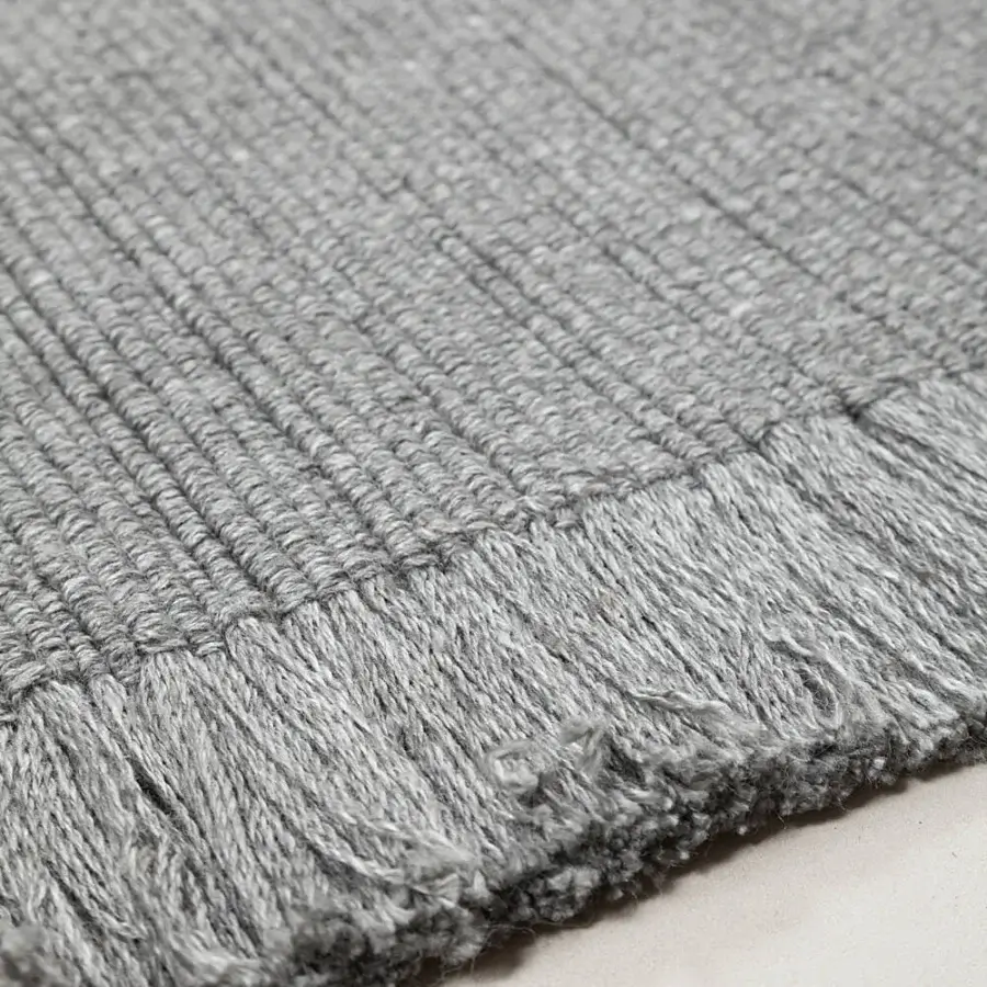 Superior Amini Pierre rug hand-woven in India from recycled PET with a subtly textured surface and hand-clipped finish