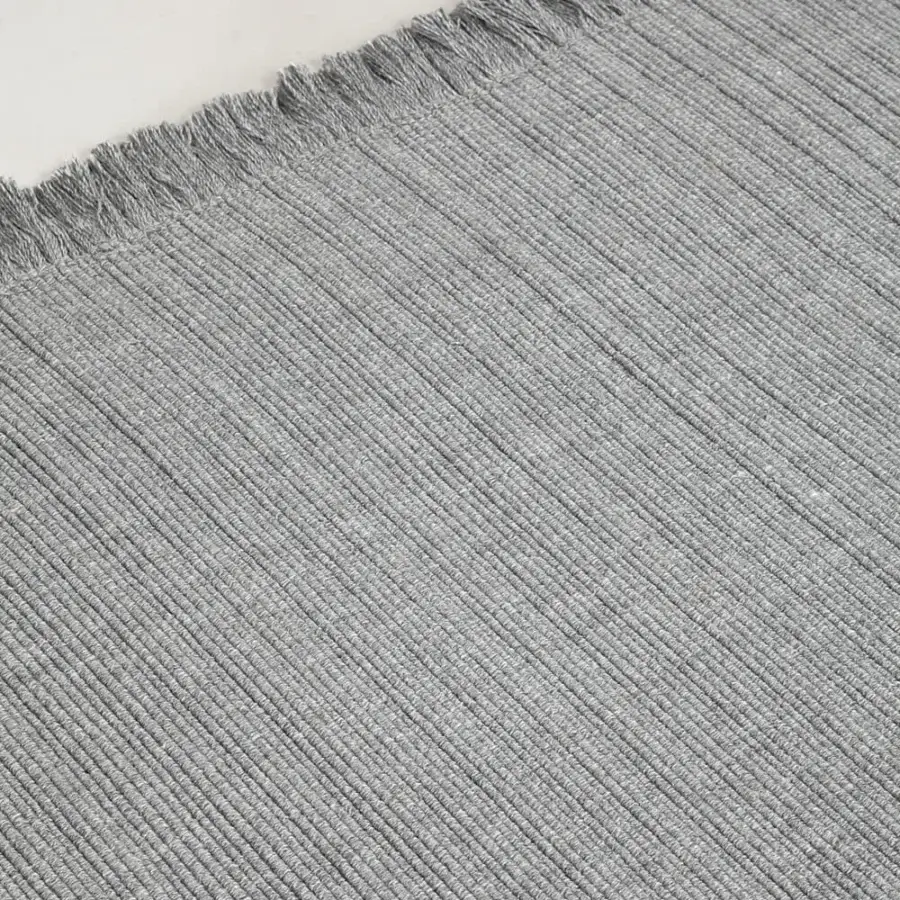 Distinguished Amini Pierre rug crafted in India with recycled PET and a heathered grey ribbed texture finished with hand clipping