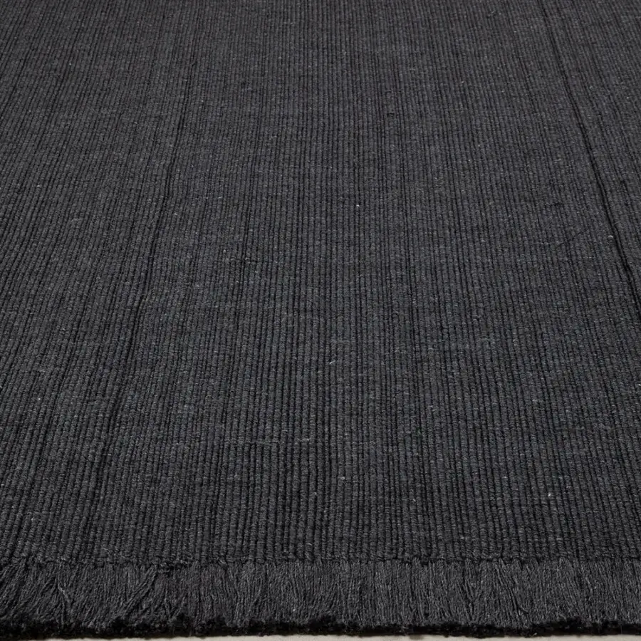 Distinguished Amini Pierre rug hand-woven in India from recycled PET with a hand-clipped edge and subtle textural variation