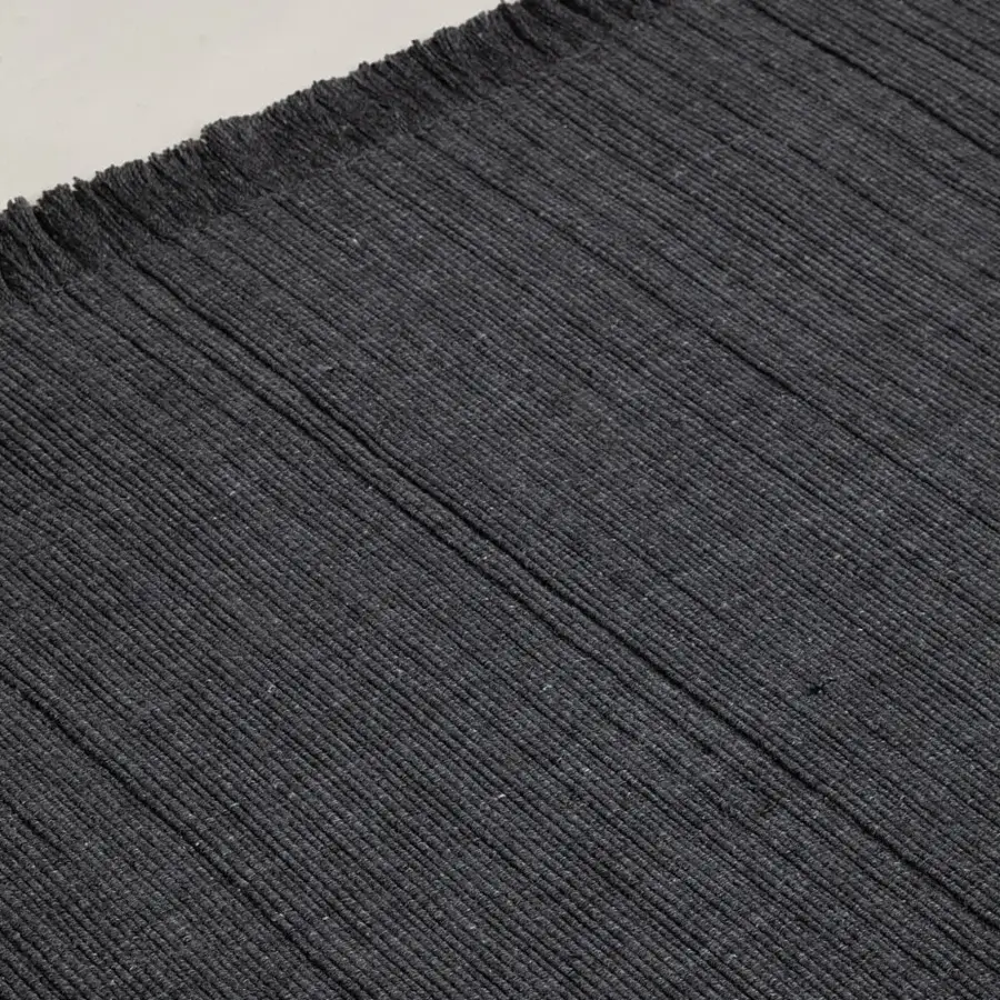 Exceptional Amini Pierre rug hand-woven in India from recycled PET with a nuanced dark gray heathered tone and hand-clipped finish