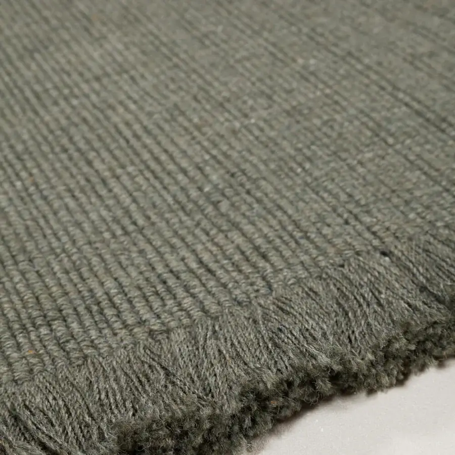 Superior Amini Pierre rug hand-woven in India from recycled PET with a hand-clipped finish and rustic olive green hue