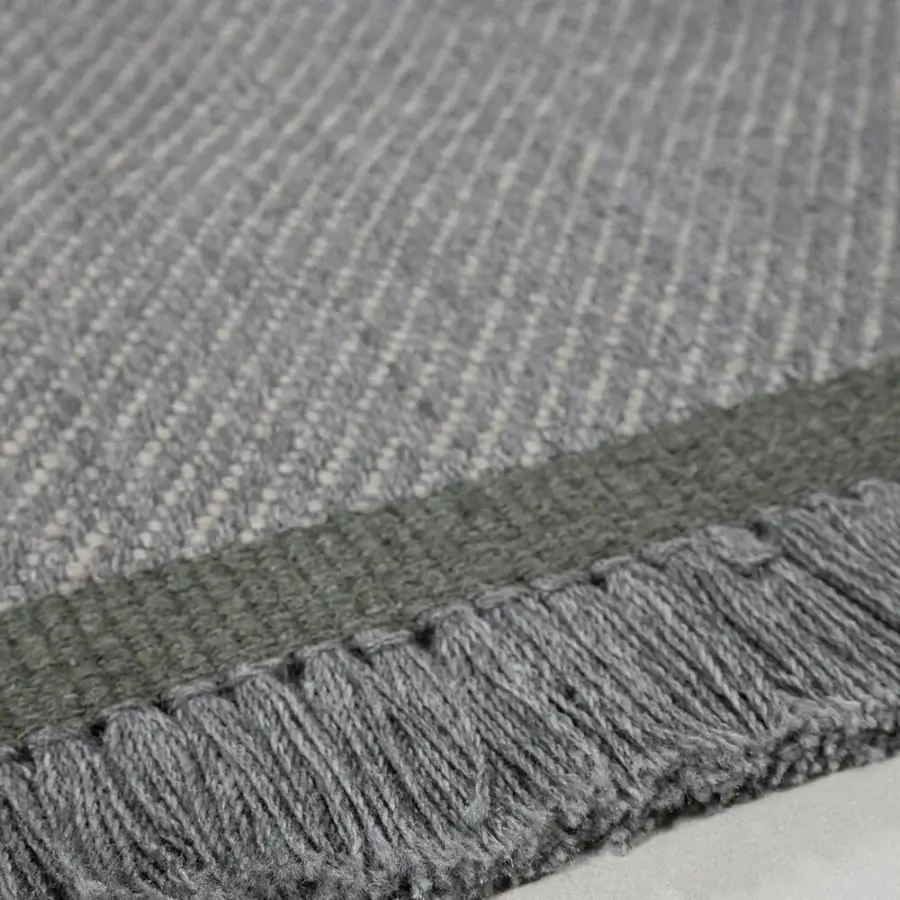 Elegant Amini Sesame rug hand-woven in recycled PET with subtle striped medium gray and muted olive green hues and fringed finish