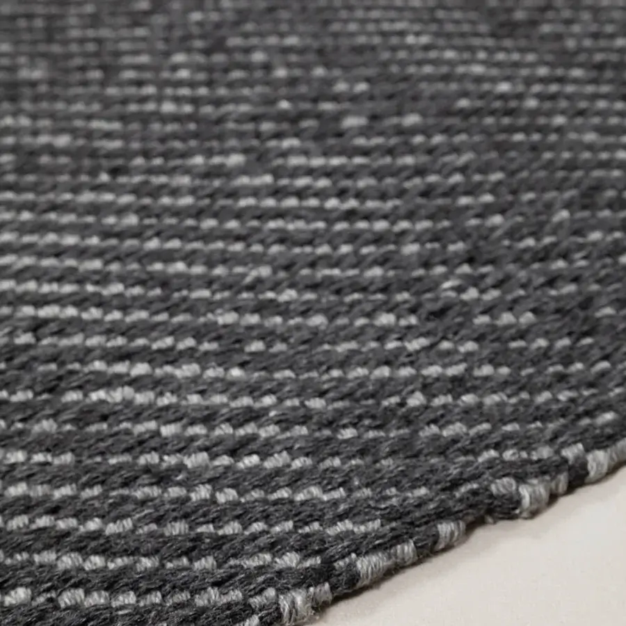 Distinguished Amini Sesame rug hand-woven in shades of gray from recycled PET with hand-clipped edges