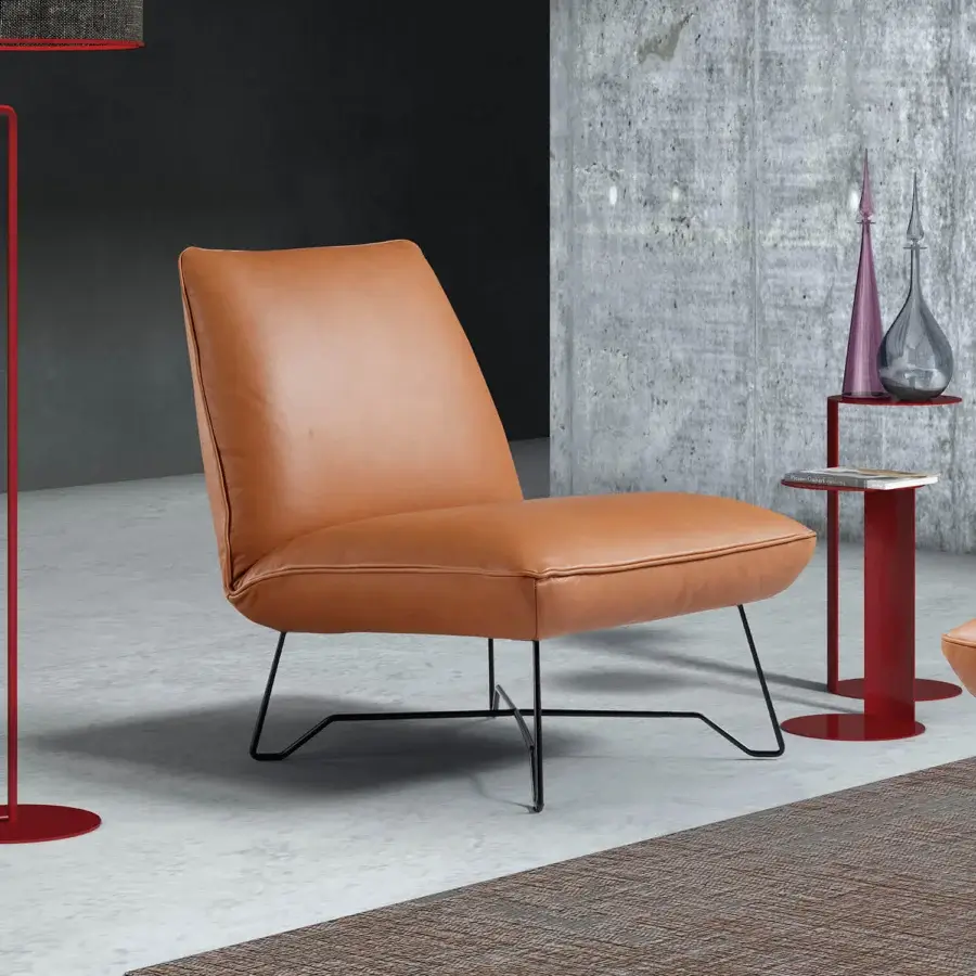Elegant Egoitaliano Lia lounge chair with reddish-brown leather upholstery and black epoxy powder-coated steel frame