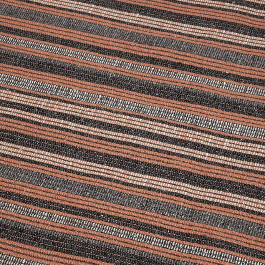 Distinguished Amini Prune rug hand-woven from recycled PET in charcoal and coral with a hand-clipped finish
