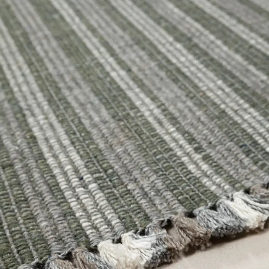 Distinctive Amini Prune rug hand-woven from recycled PET with sage green and grey tones and soft fringe detailing