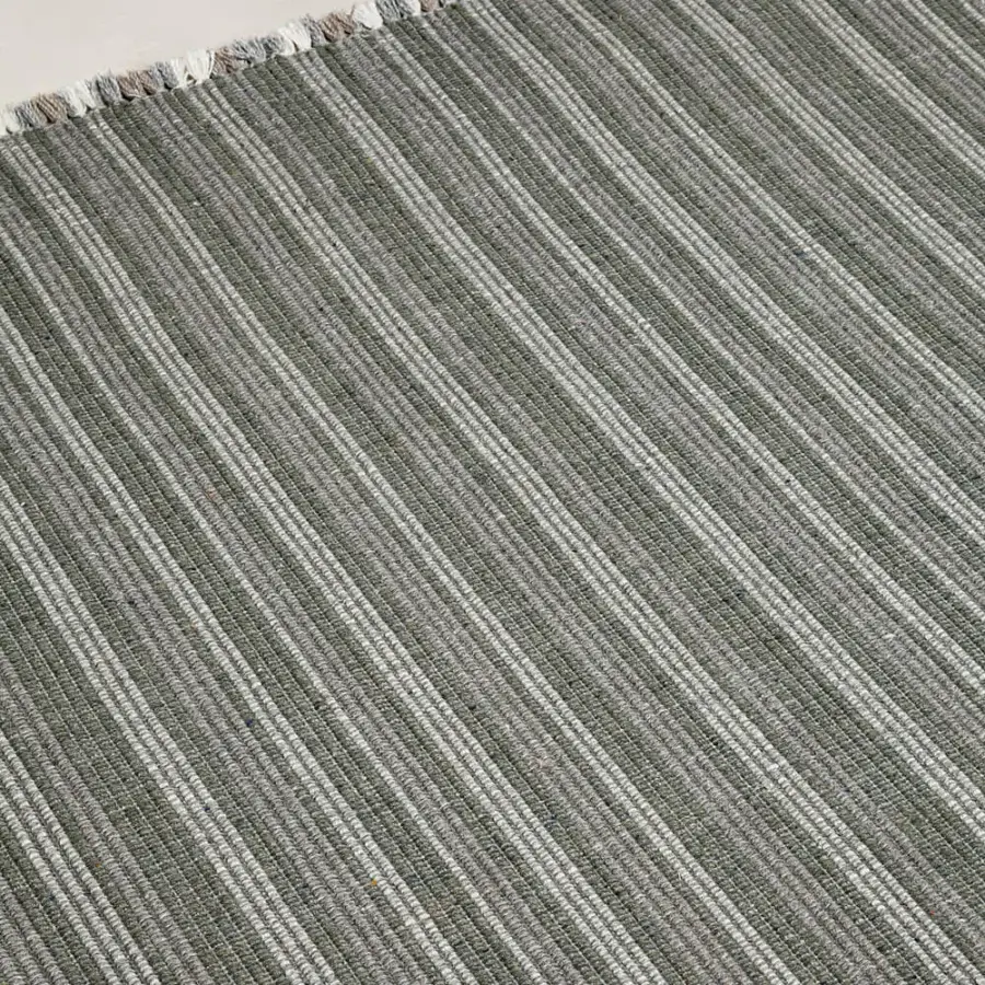 Superior Amini Prune rug hand-woven from recycled PET with muted gray-green stripes and raw hand-clipped fringe