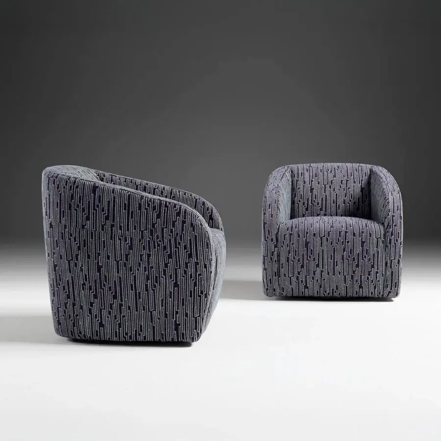 Distinguished Egoitaliano Carlotta lounge chair with dark navy geometric textile upholstery and tubular steel swivel base