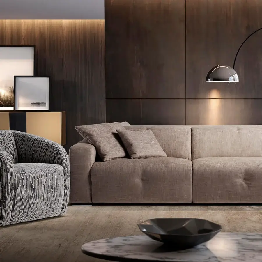 Superior Egoitaliano Carlotta lounge chair with neutral beige woven textile and rounded fully upholstered silhouette