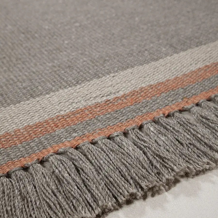 Superior Amini Coco rug hand-woven from recycled PET with terracotta-like orange stripes and a hand-clipped finish