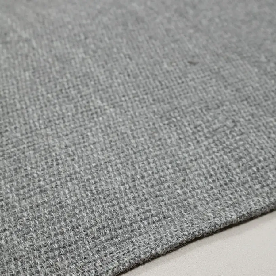 Distinguished Amini Coco rug hand-woven in India from 100% recycled PET with tonal variations and hand clipping