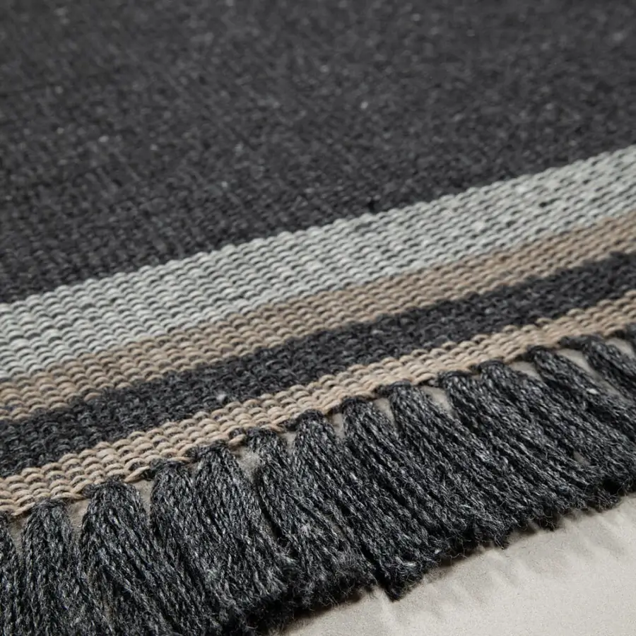 Exceptional Amini Coco rug with subtle striped design crafted from recycled PET and finished with hand-clipped detailing