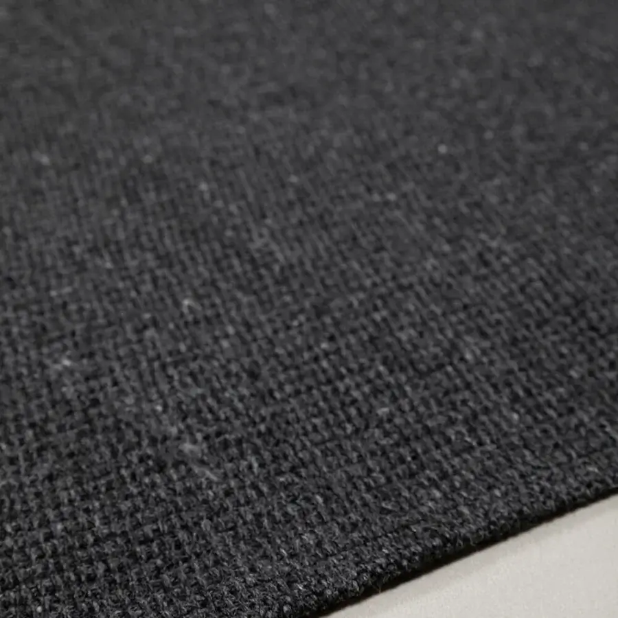 Elegant Amini Coco rug with minimalist aesthetic crafted from recycled PET in a dark charcoal hue with hand-clipped finish