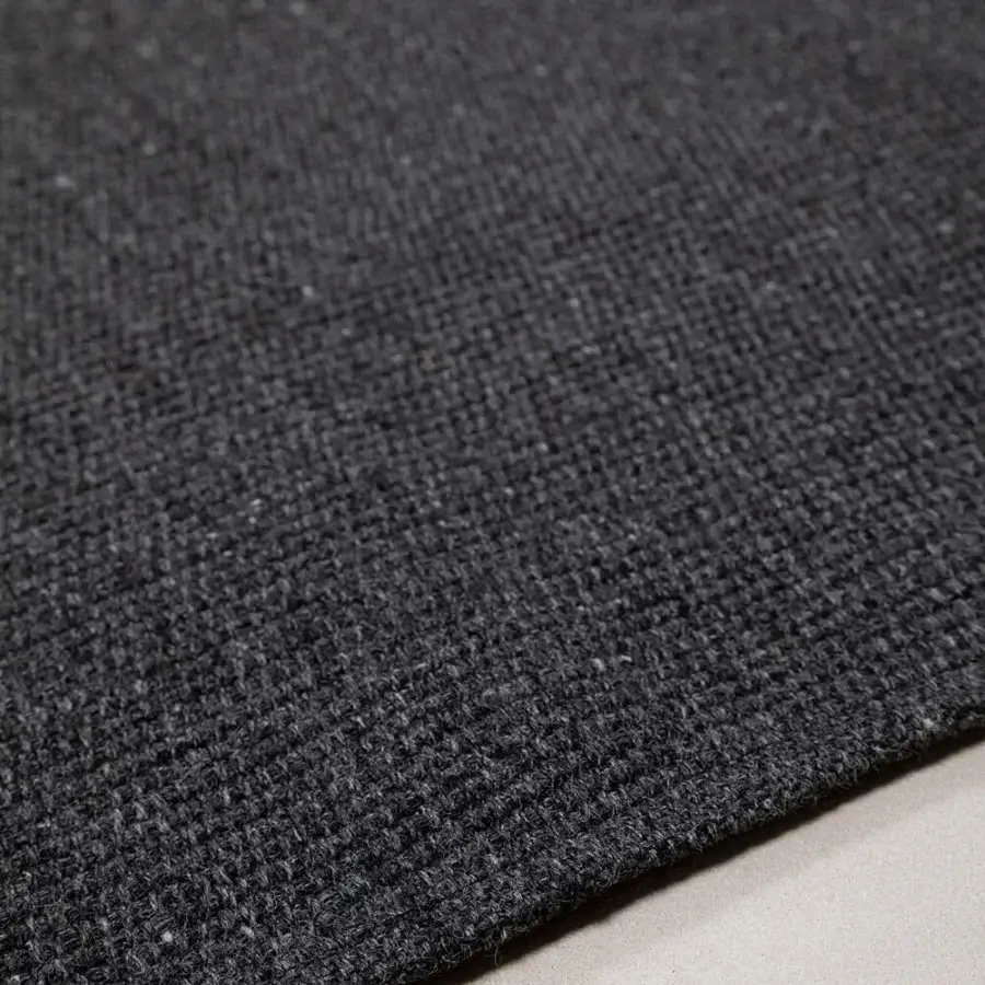 Exceptional Amini Coco rug with nuanced dark grey coloration crafted from 100% recycled PET with a hand-clipped finish