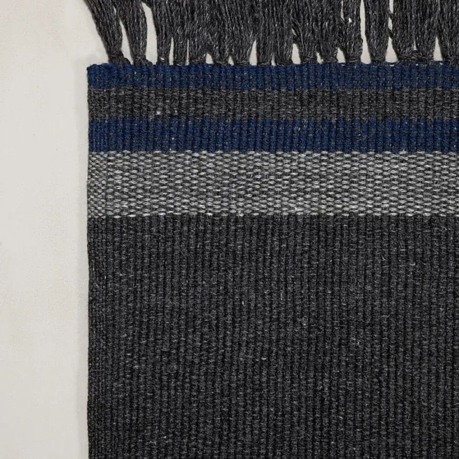 Distinguished Amini Coco rug with a distinctive linear pattern hand-woven in recycled PET with a hand-clipped finish
