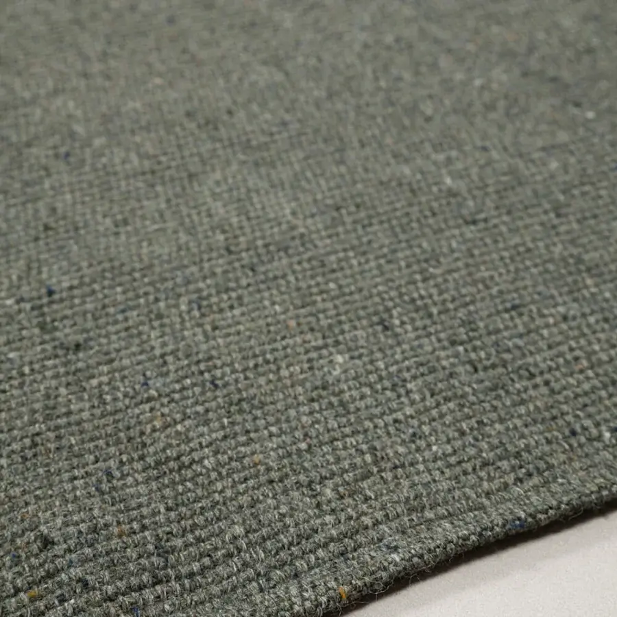 Distinguished Amini Coco rug with heathered grayish-green and blue tones crafted from 100% recycled PET with hand clipping