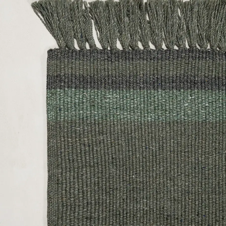 Exceptional Amini Coco rug with muted olive green hues and subtle tonal variations hand clipped from recycled PET