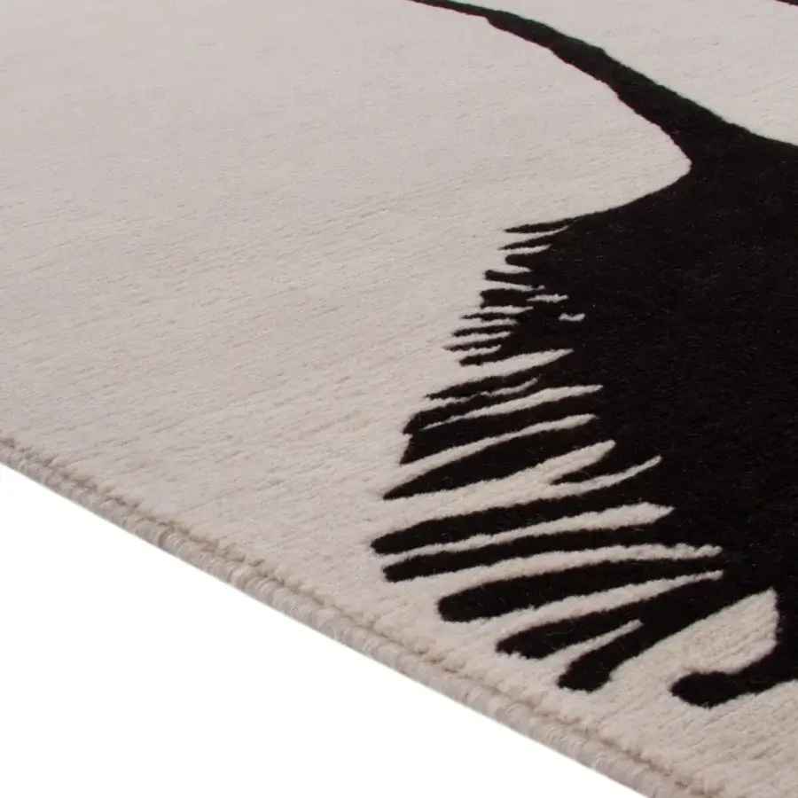 Exclusive René Gruau Amini Woman rug hand-knotted in New Zealand wool with a captivating black and ivory graphic silhouette and carved finish