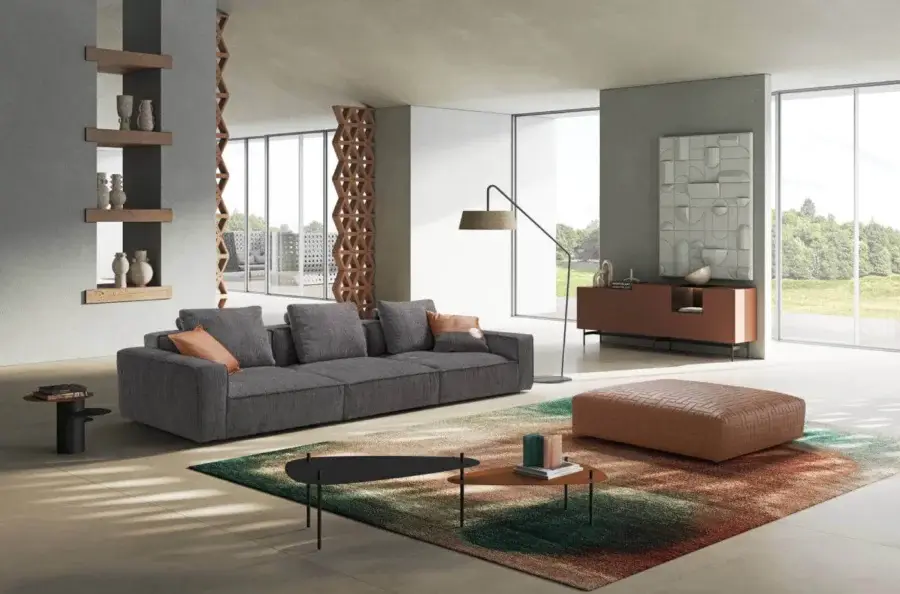 Superior Egoitaliano Plaza sofa with textured gray textile upholstery and warm orange cushions crafted with quilted leather detail
