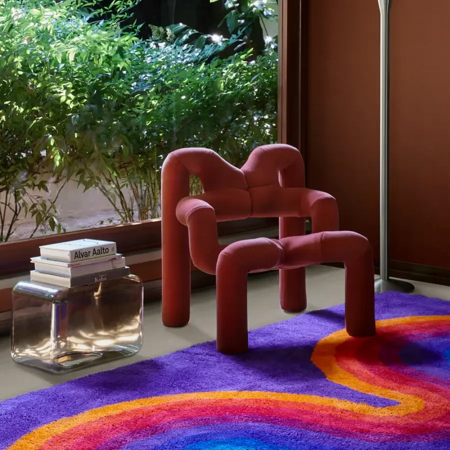 Exceptional Amini Romantica-Curve rug with swirling design in purple, blue, orange, red, and yellow New Zealand wool, hand-washed and carved