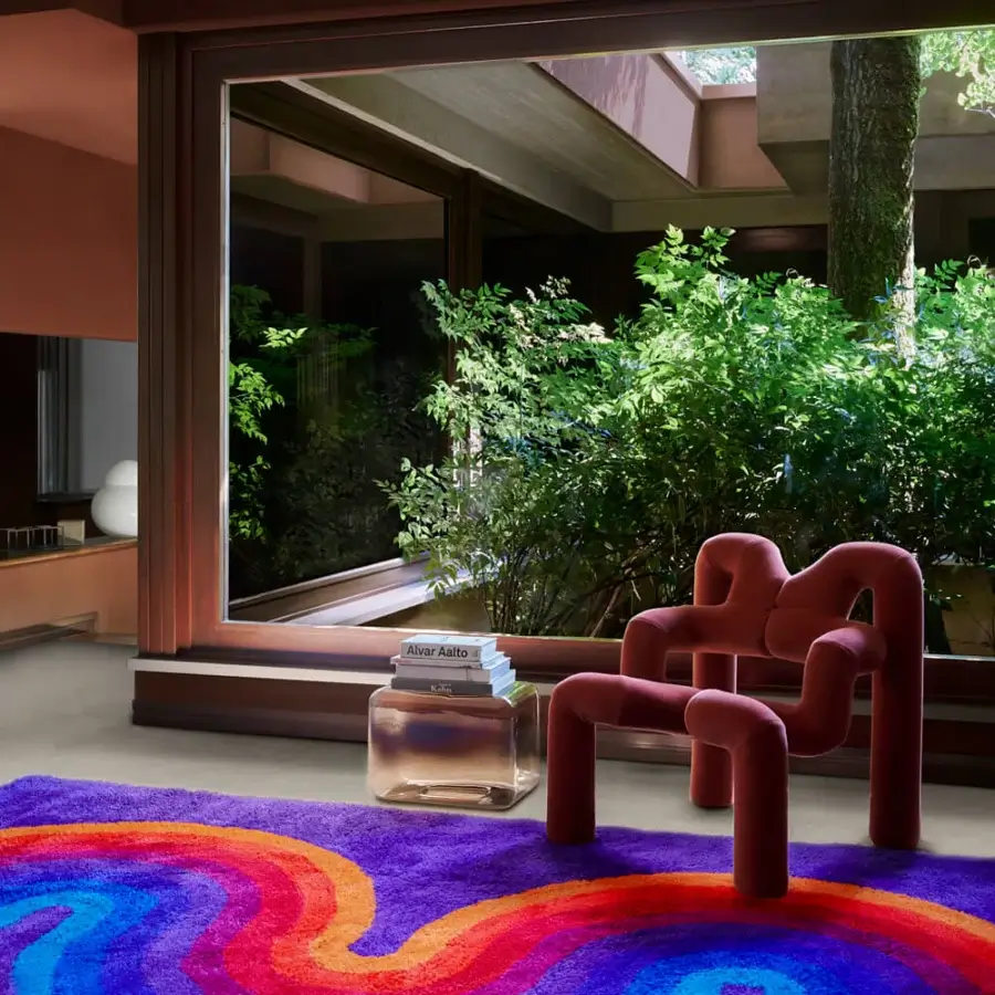 Distinguished Amini Romantica-Curve rug crafted with vibrant blue, orange, and red waves in plush New Zealand wool with hand-washed finish