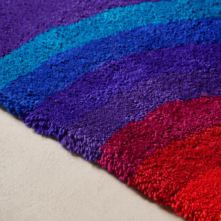 Exceptional Amini Romantica-Curve rug crafted with flowing gradients of warm and cool tones in New Zealand wool with a hand-washed texture