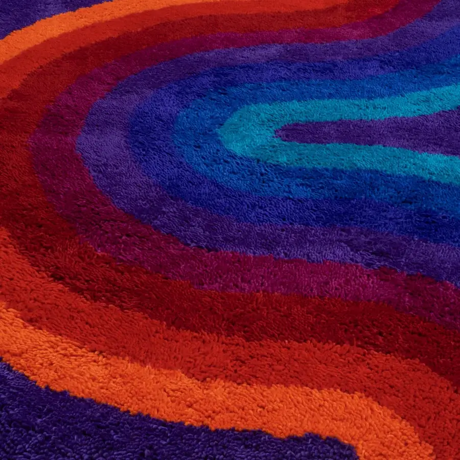 Superior Amini Romantica-Curve rug hand-tufted with purple, orange, red, and turquoise New Zealand wool exhibiting a carved finish